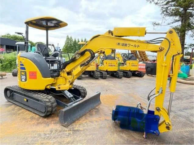Mini excavator with a Kenki World decal in the Tsukuba yard